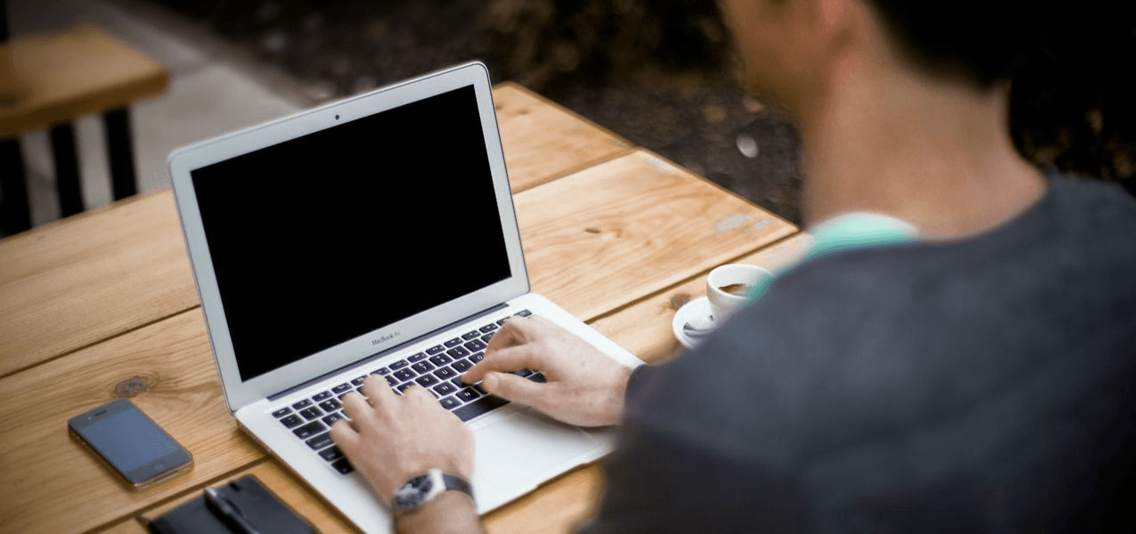 Man typing on laptop